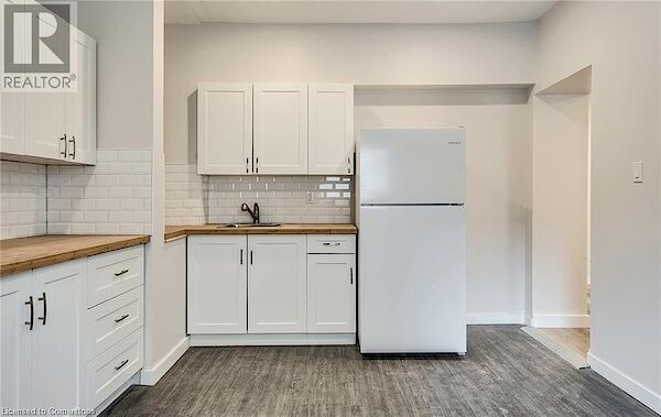 Kitchen+with+freestanding+refrigerator+wood+counters+a+sink+and+white+cabinetry Hamilton 1 bedroom Apartment for rent. Property photo: 637729-3