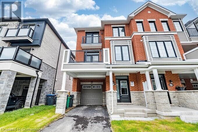 View+of+front+of+home+with+an+attached+garage+brick+siding+asphalt+driveway+stone+siding+and+a+balcony Brampton 3 bedrooms Townhouse for rent. Property photo: 640684-1